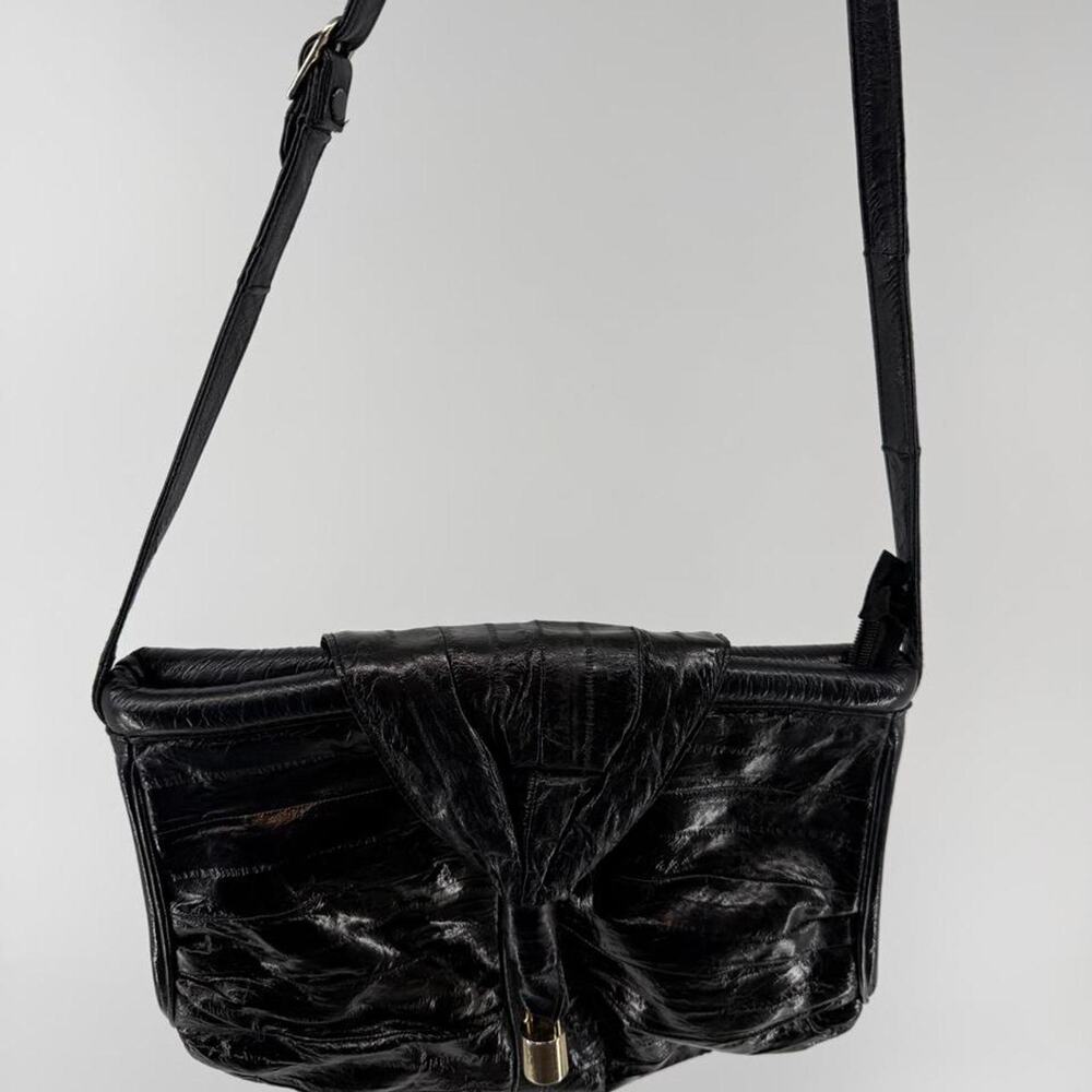 Vintage 1980s eel leather shoulder bag with gold hardware suede lining